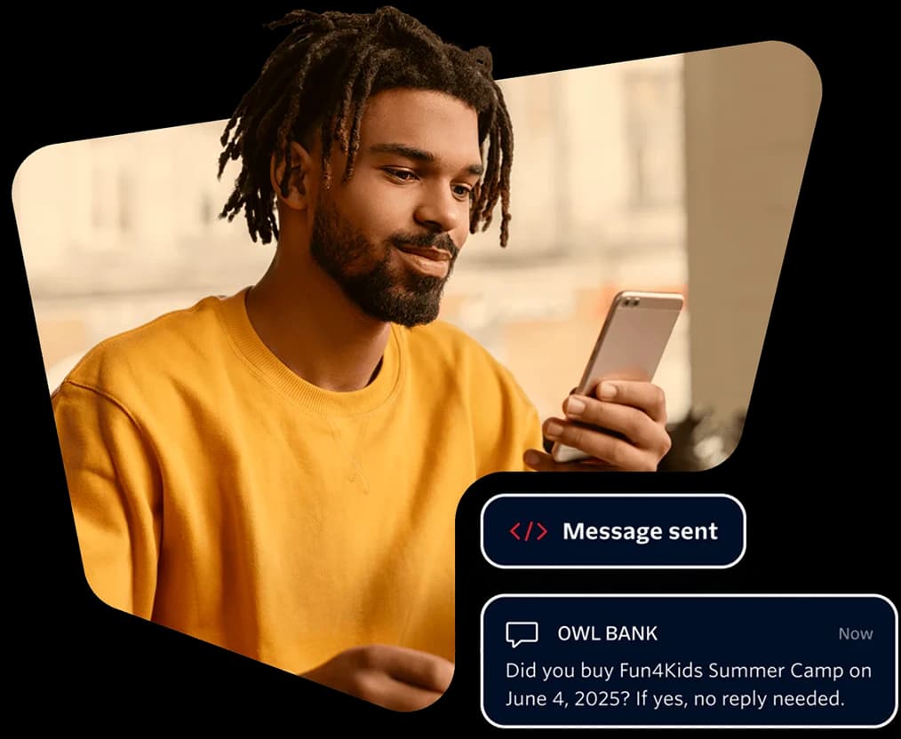 A customer reading a text message on their phone